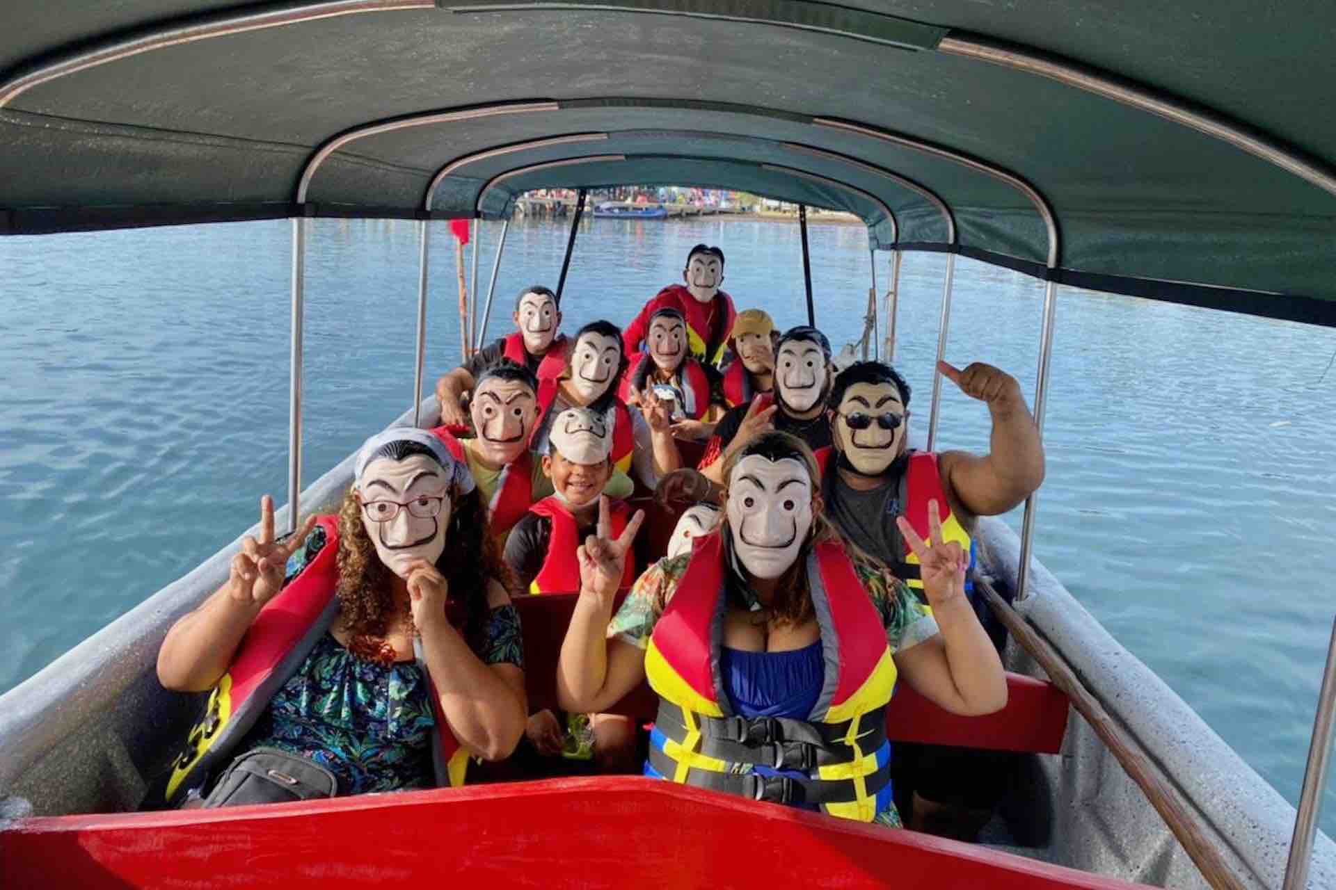 Isla Pelicano San Blas tour boat with guests in masks