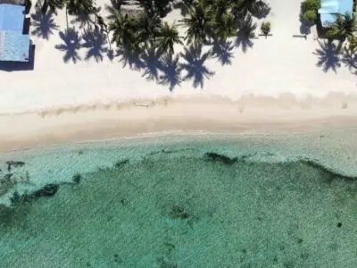 San Blas Isla Ina island aerial dron view of beach and ocean reef