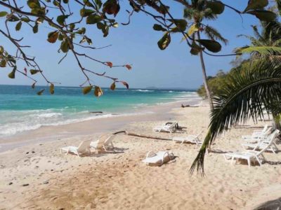 Sonny Island Resort Panama white sand beach with chairs