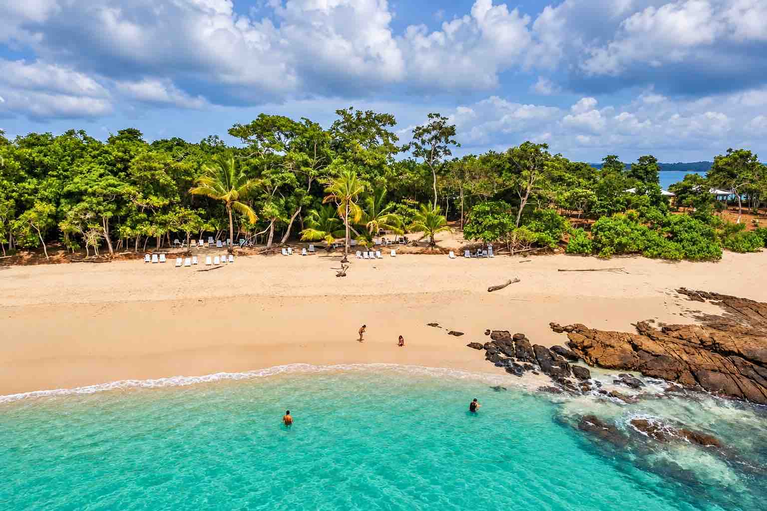 Aerial view of guests enjoying the beach and sea during a Pearl Islands Panama Day Trip