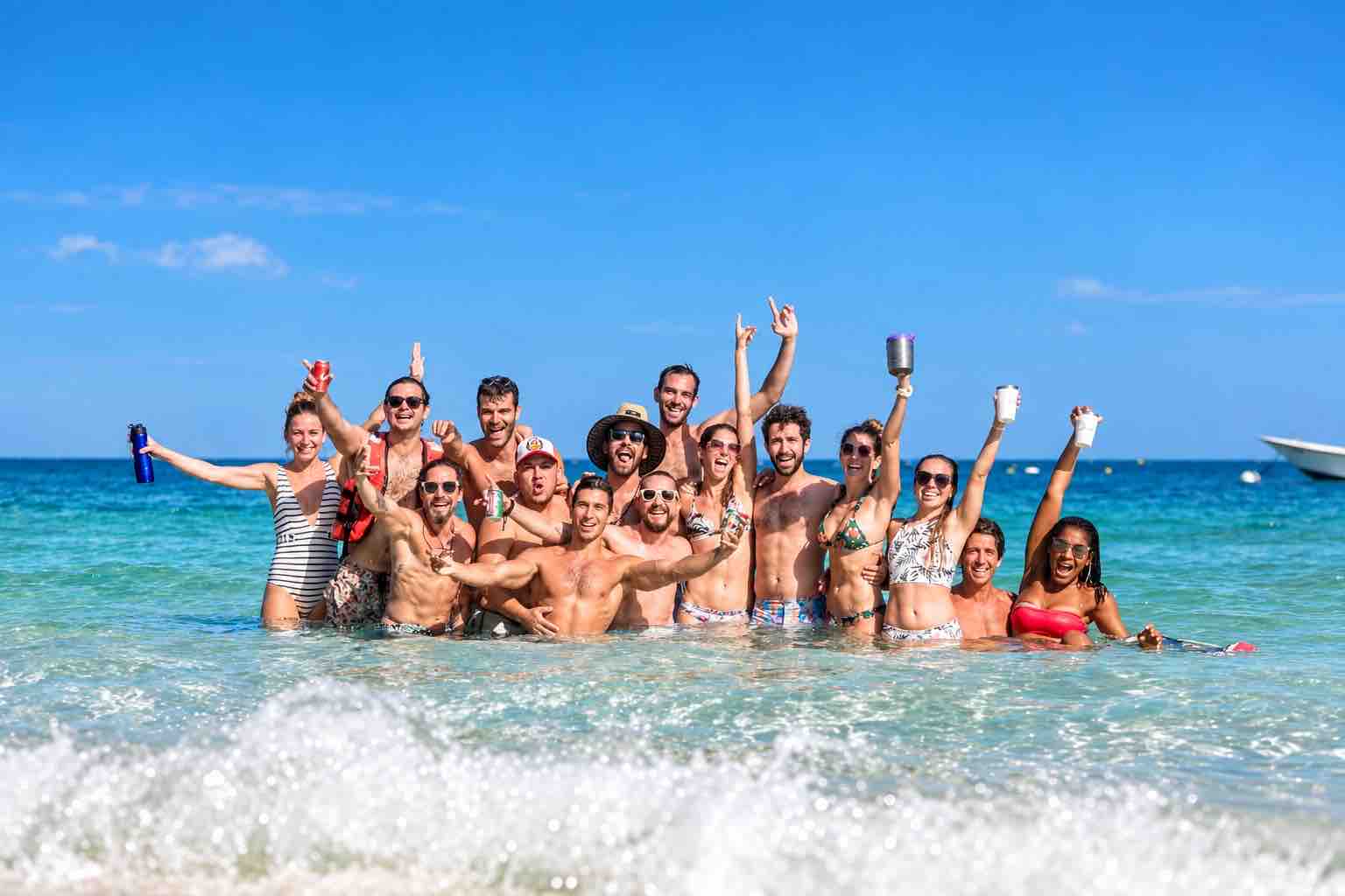 Group of guests celebrating in the ocean during a Pearl Islands Panama Day Trip