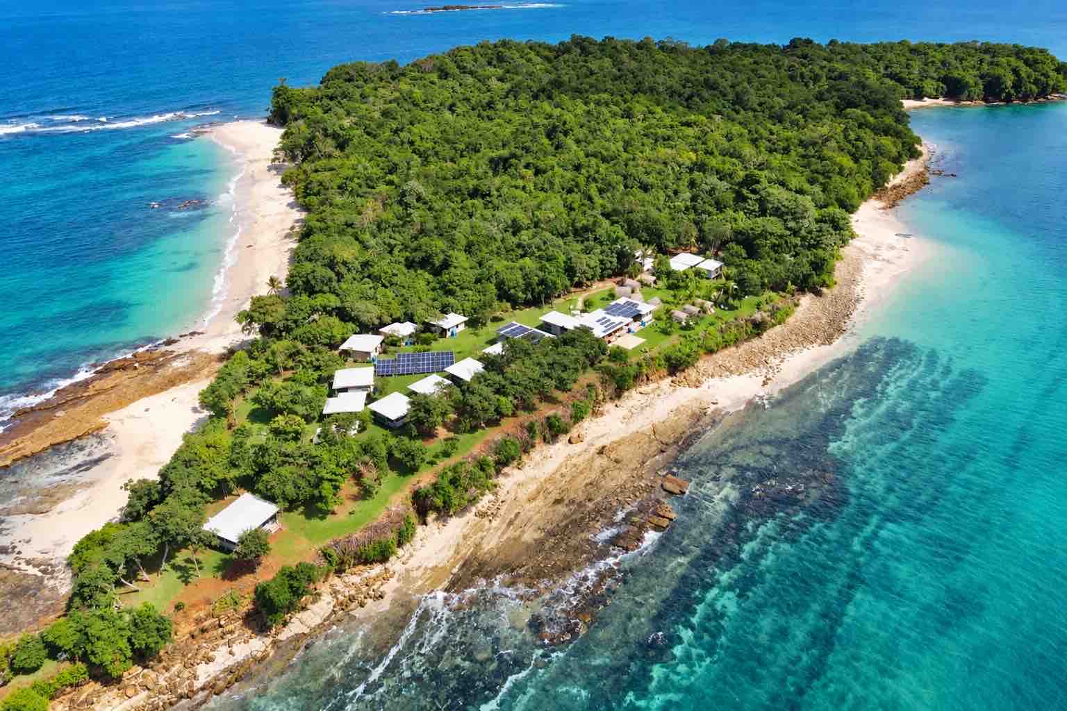 Aerial view of Sonny Island Resort cabins and shoreline for a Pearl Islands Panama Day Trip