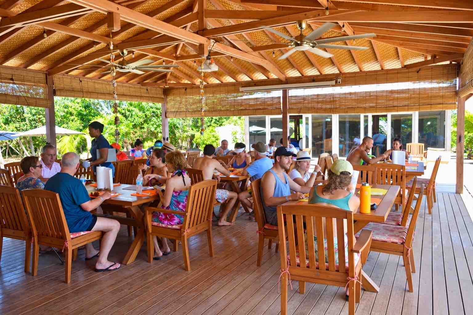 Guests seated in an open-sided wooden restaurant during a Pearl Islands Panama Day Trip