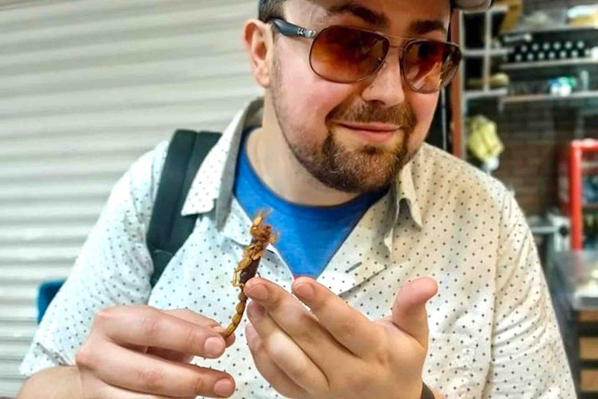 Mexico City Culinary Tour guest with scorpion