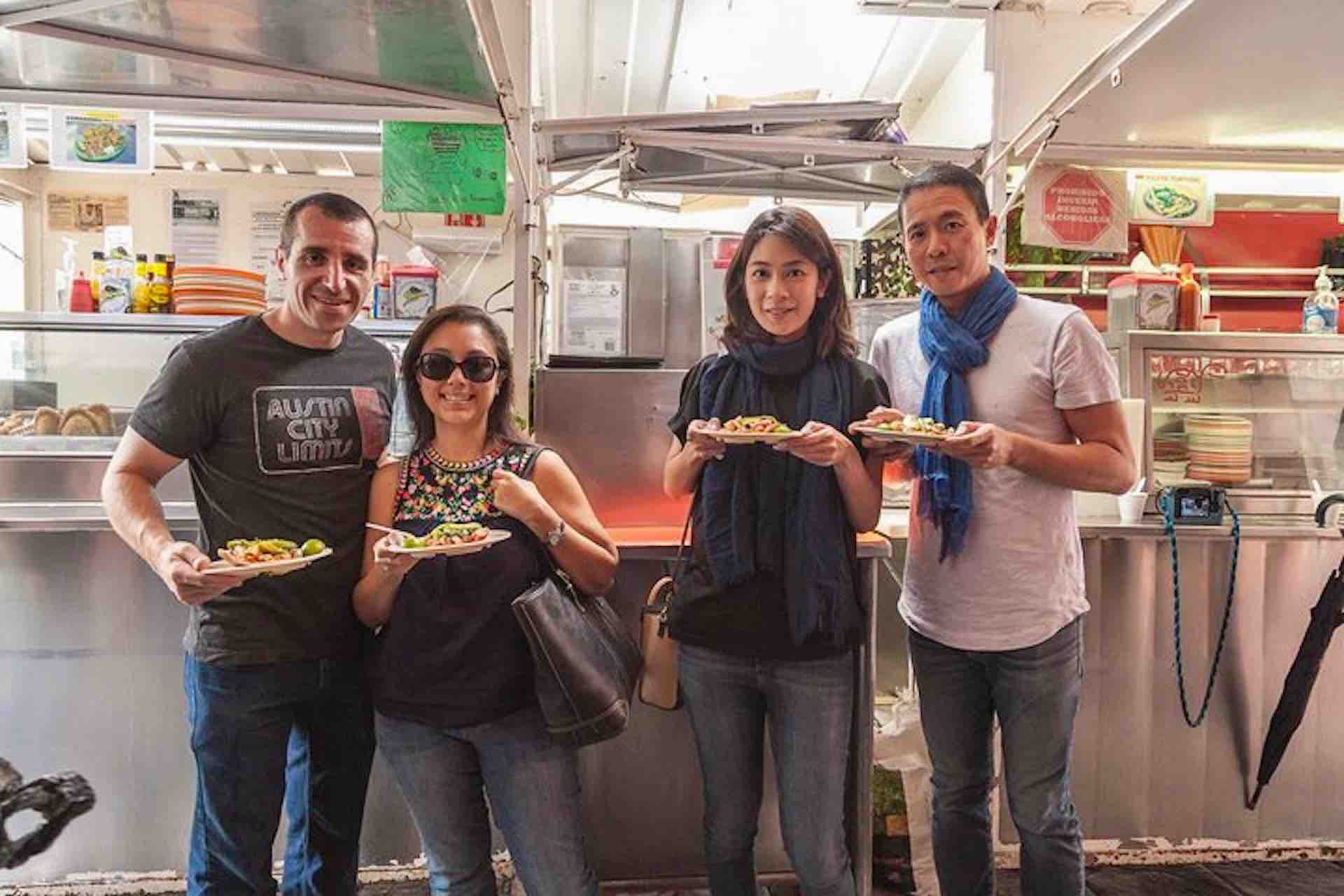 Mexico City Culinary Tour guests holding plates