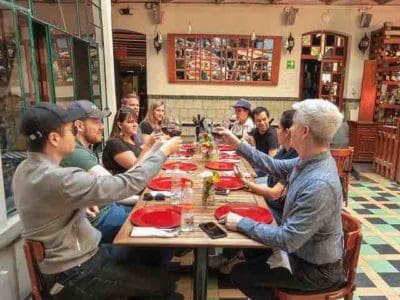 Mexico City Culinary tour guests on table in restaurant with wine 1