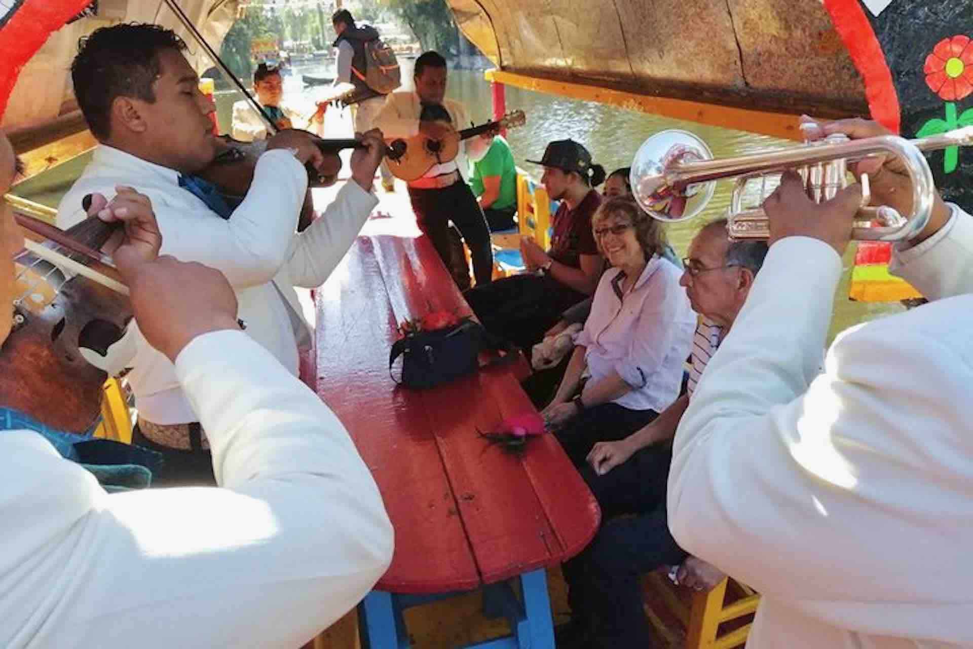 Xochimilco Mexico visitors on boat Frida Kahlo tour
