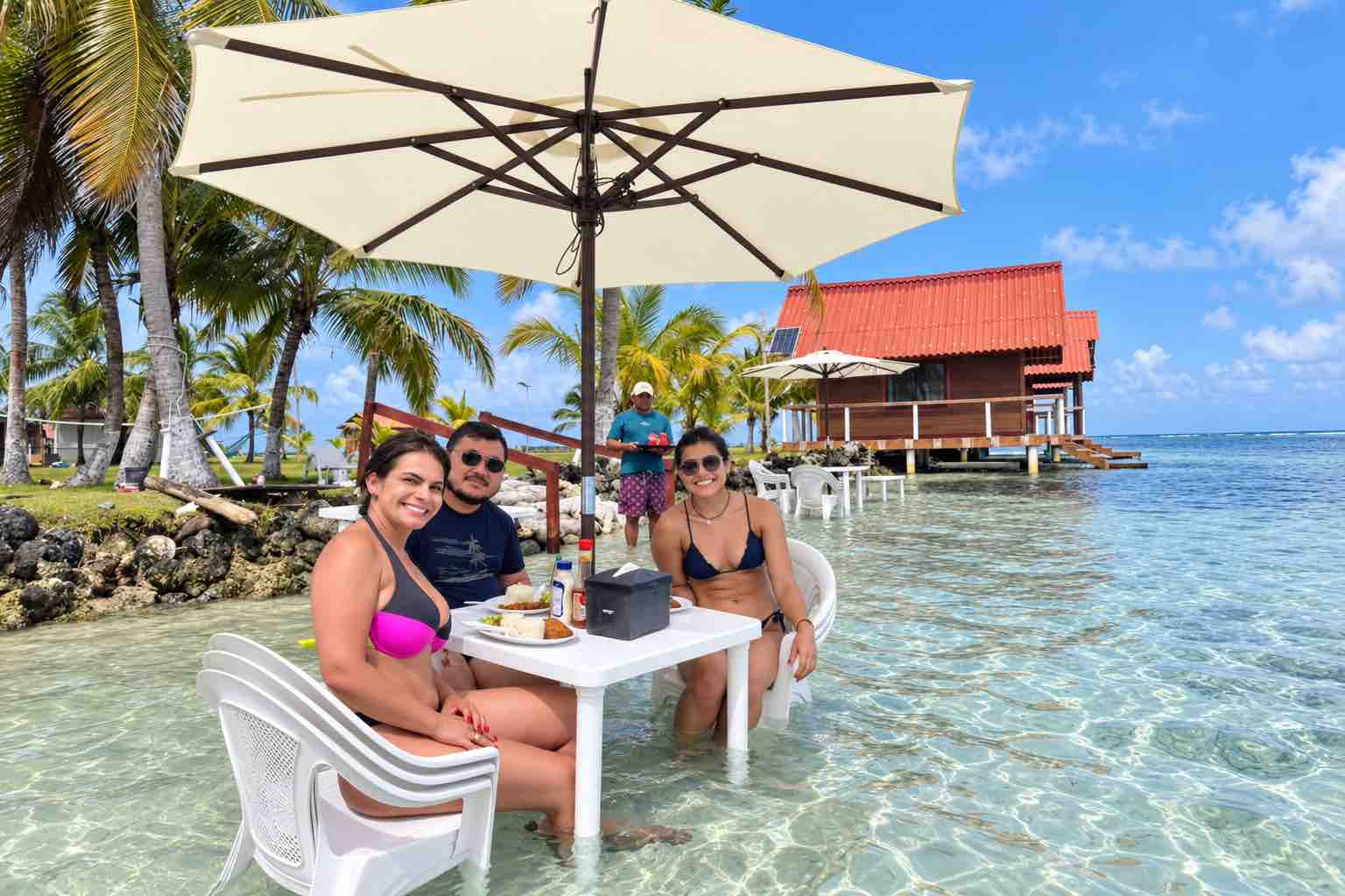 Guests enjoying lunch in the shallow water at Isla Guasirdup in San Blas