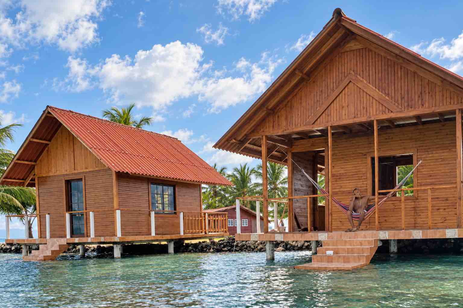 Wooden overwater cabins on Isla Guasirdup viewed from the Caribbean Sea