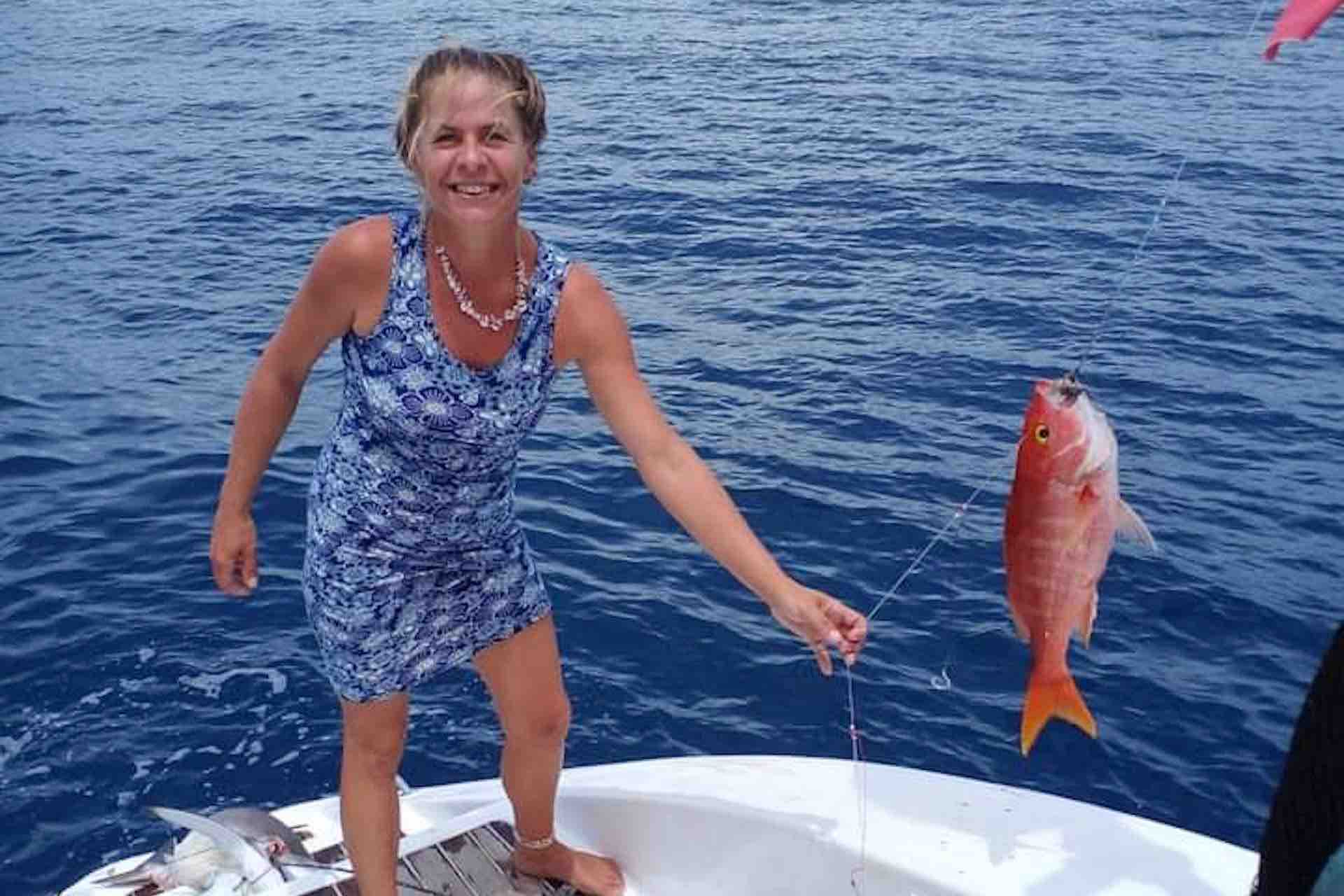 San Blas catamaran charter woman holding fish