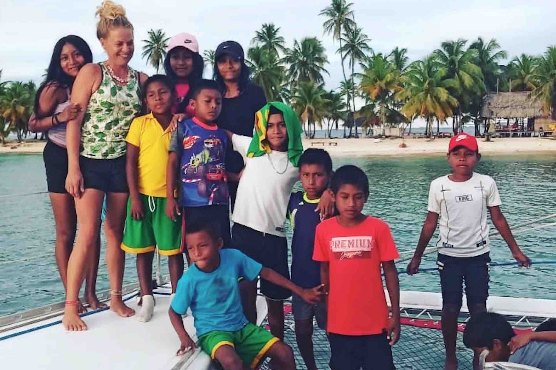 San Blas catamaran charter woman with Kuna kids
