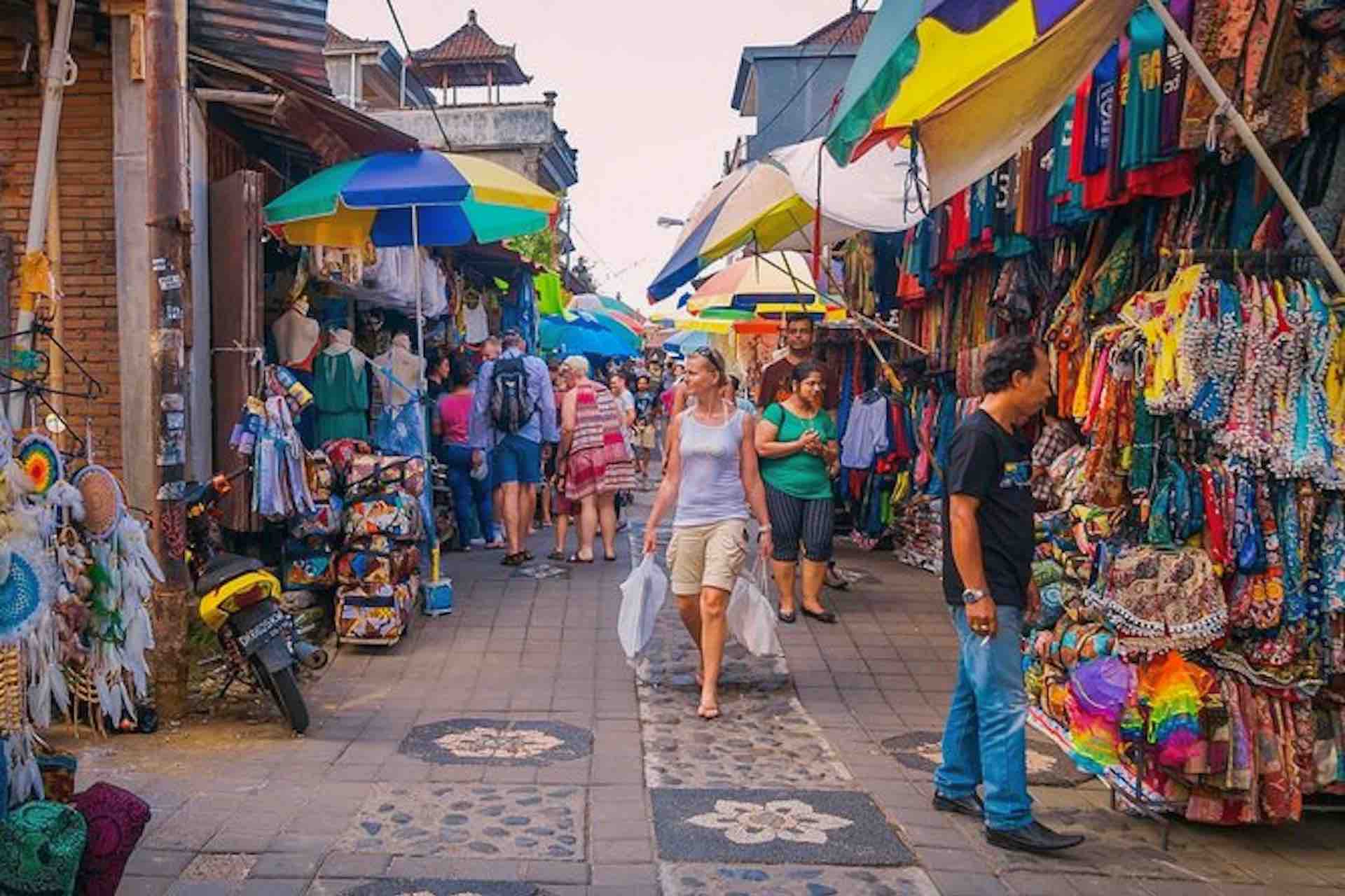 Ubud shopping street tourist with bags and Bali Bird Park tour