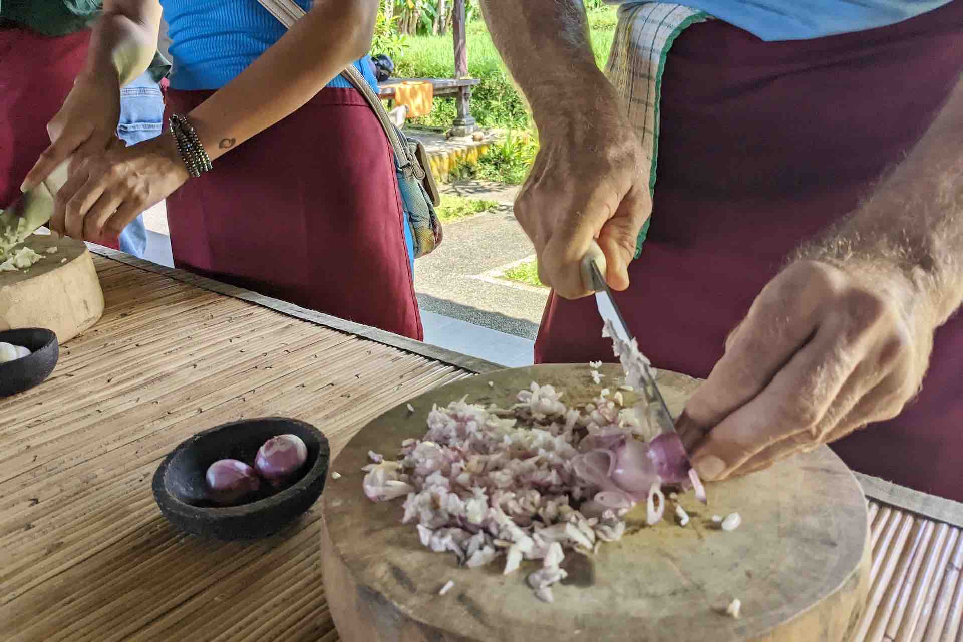 Bali cooking class guests cutting ingredients2