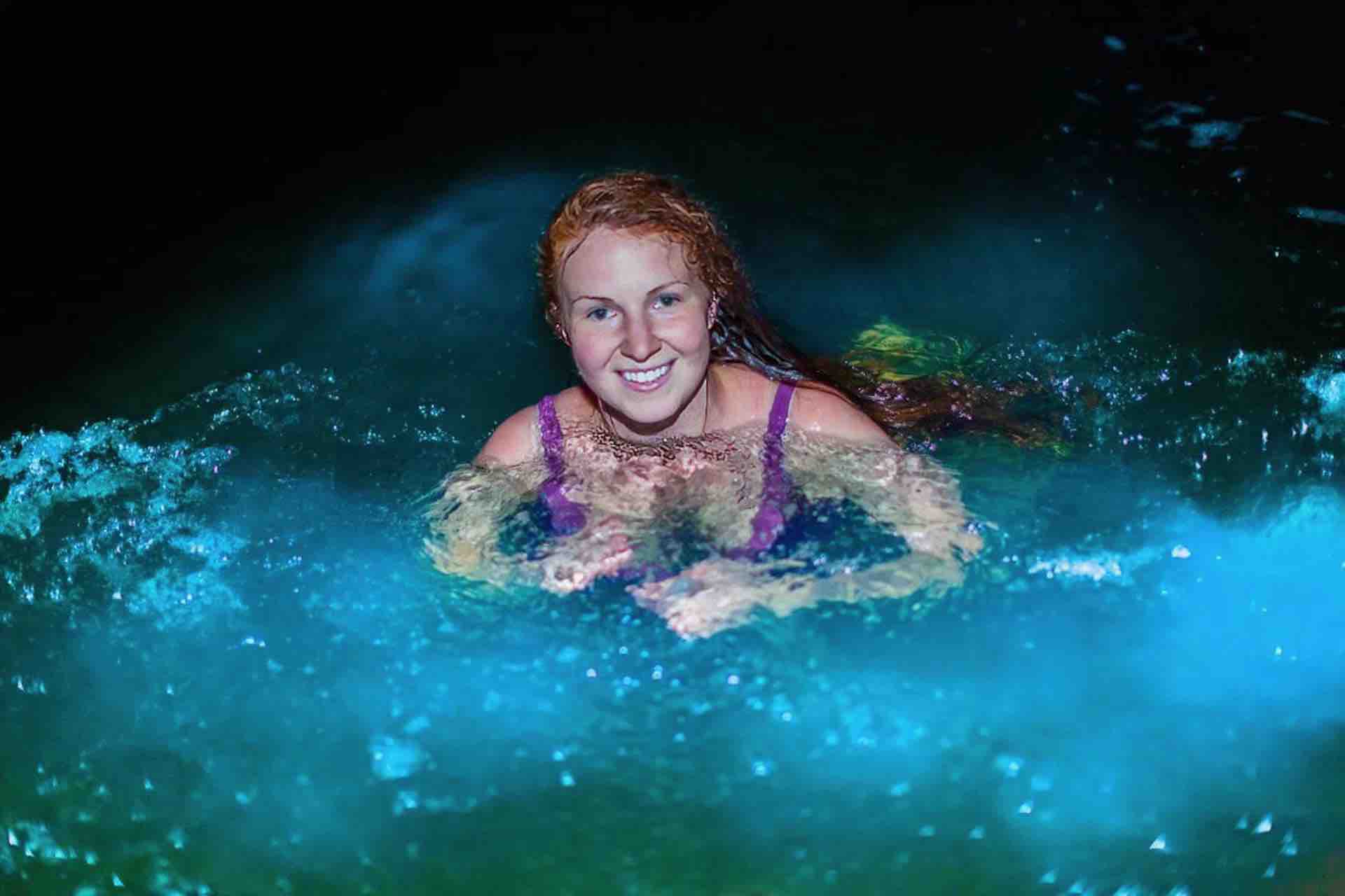 Bocas del Toro bioluminescense tour guest in water