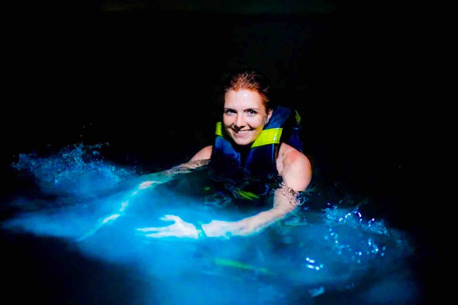 Bocas del Toro Bioluminescence tour woman in water