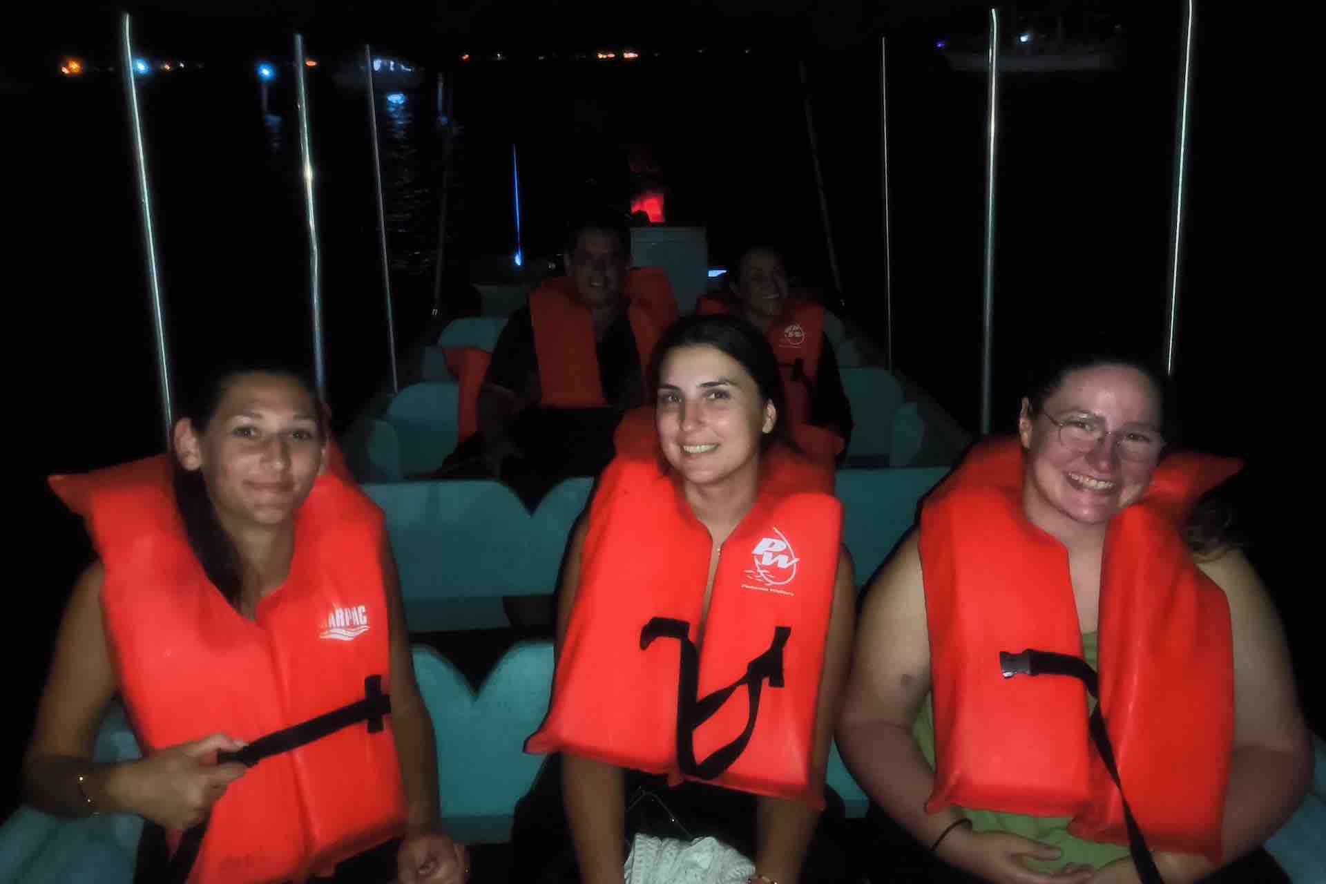 Guests on a nighttime boat tour in Bocas del Toro