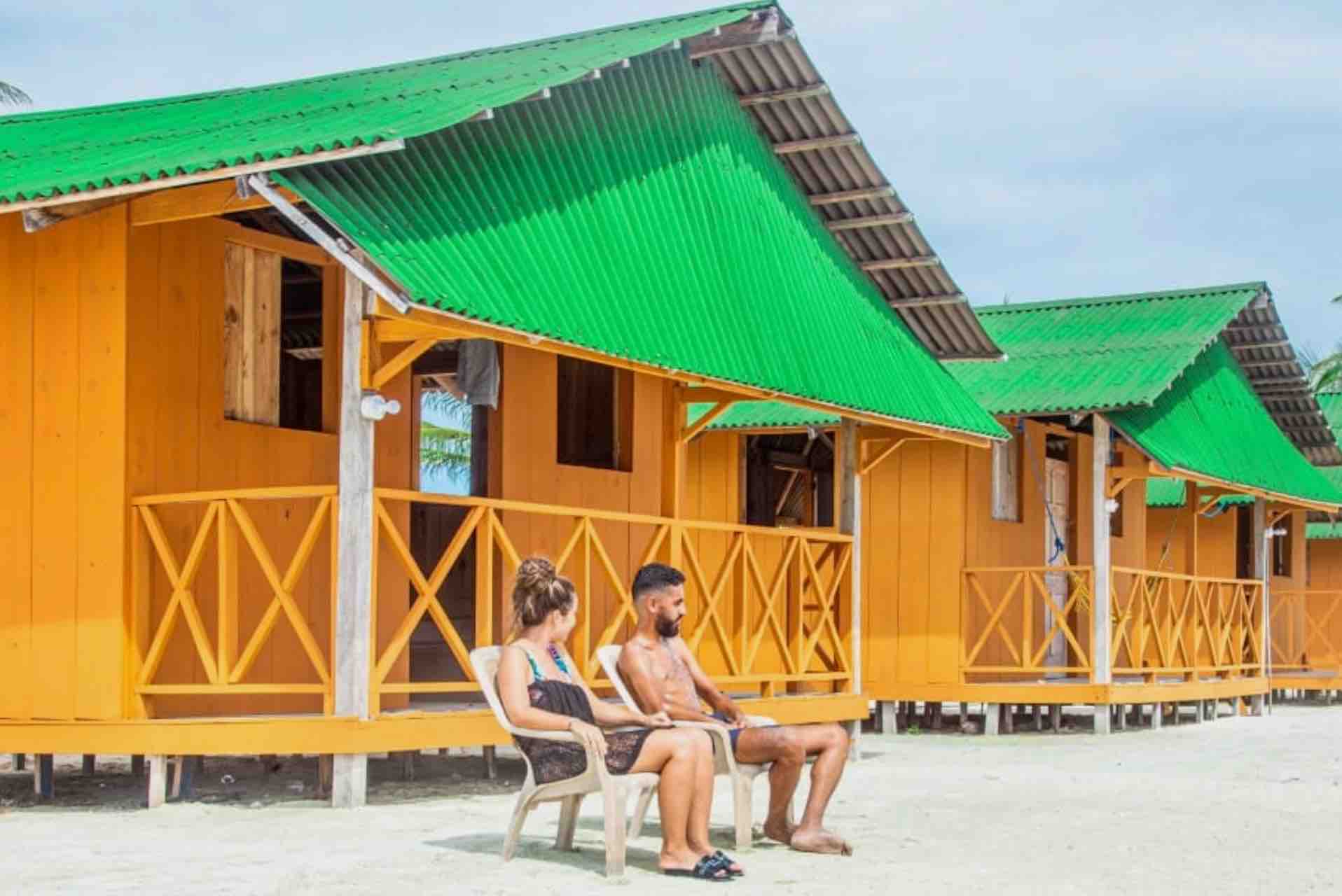 San Blas Isla Miryadup island private cabin guests sitting in beach chairs