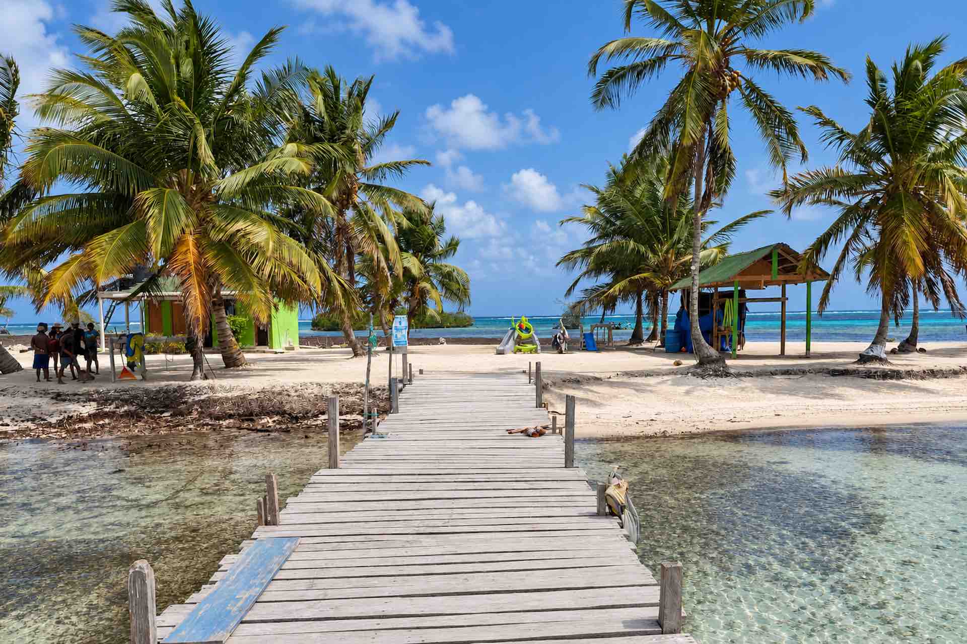 Wooden arrival dock beside shallow water on Isla Miryadup, San Blas