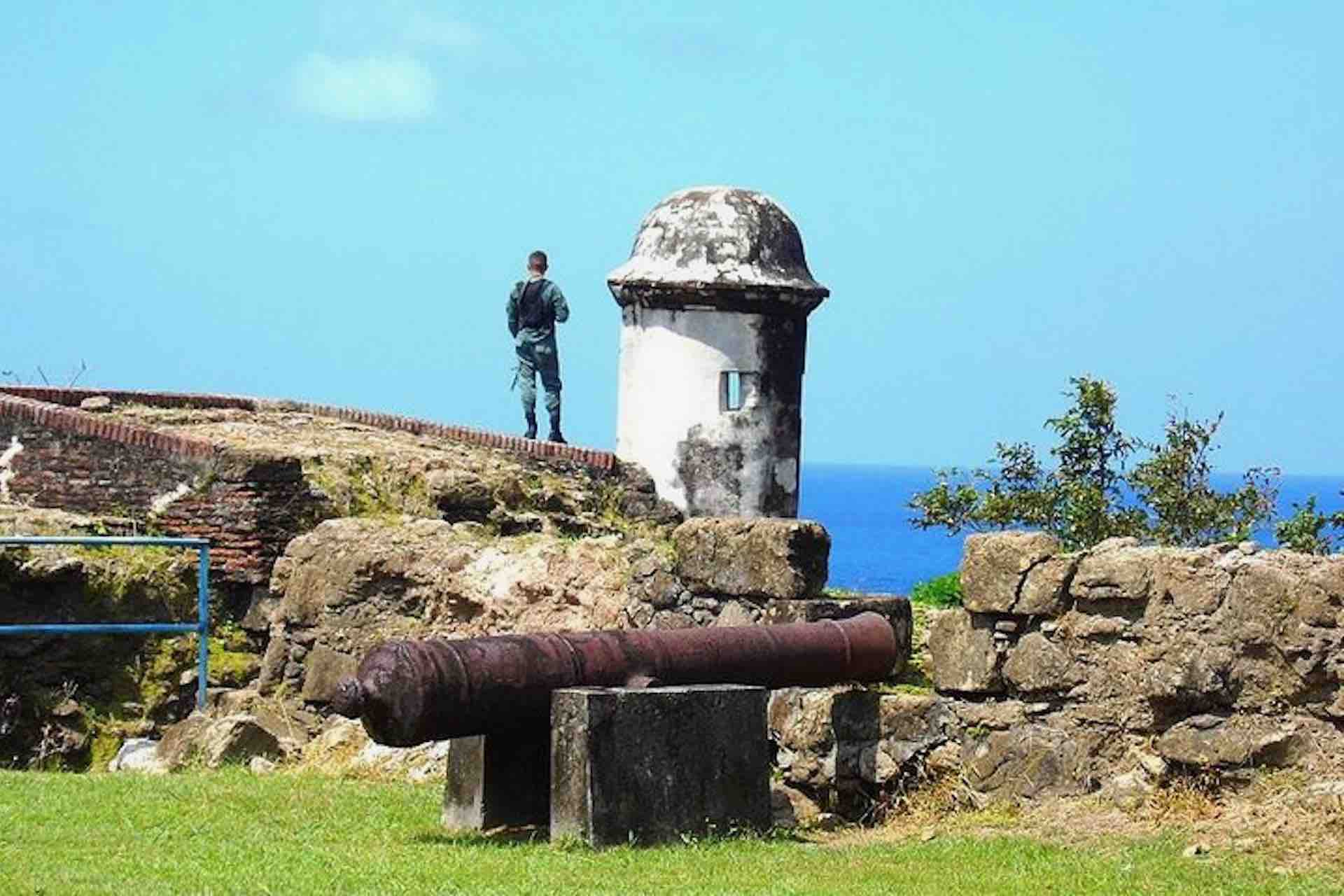 Historic cannon, stone walls, and a sentry tower at Fort San Lorenzo on the Ocean to Ocean Panama Canal Tour