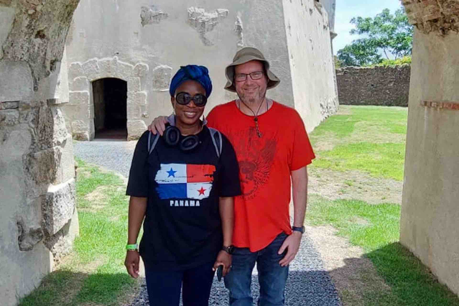 Couple posing beneath a stone arch at Fort San Lorenzo on the Ocean to Ocean Panama Canal Tour