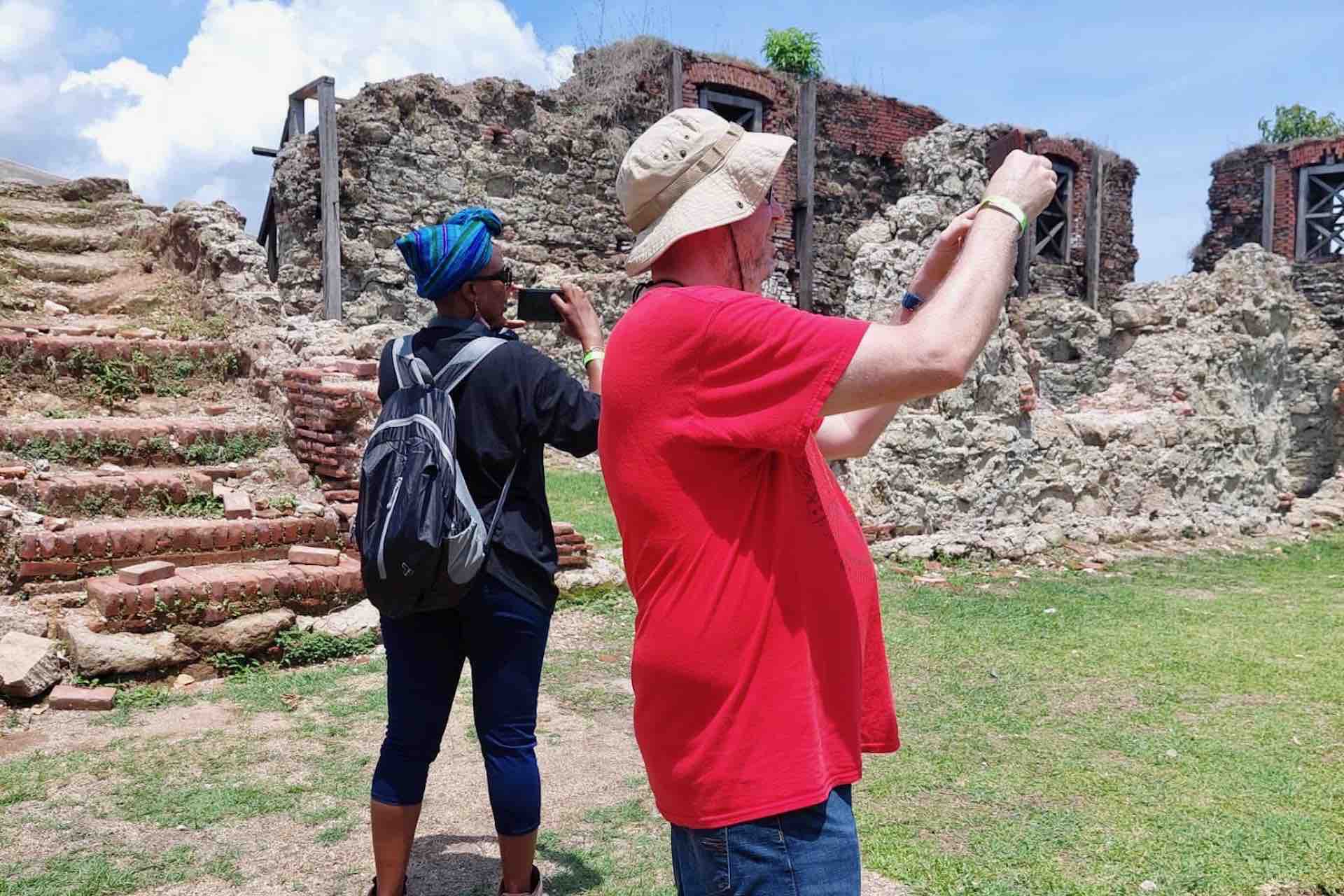 Guests photographing the stone ruins and stairs at Fort San Lorenzo on the Ocean to Ocean Panama Canal Tour
