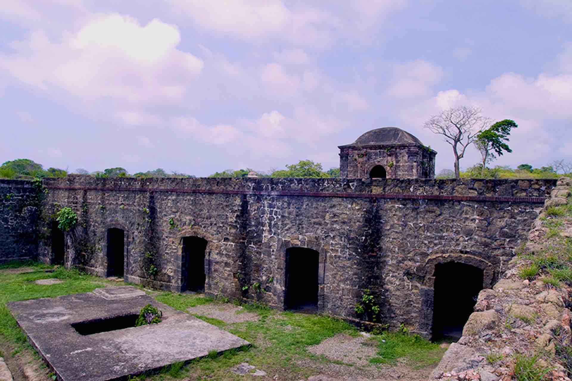Stone walls and arched entrances inside Fort San Lorenzo on the Ocean to Ocean Panama Canal Tour
