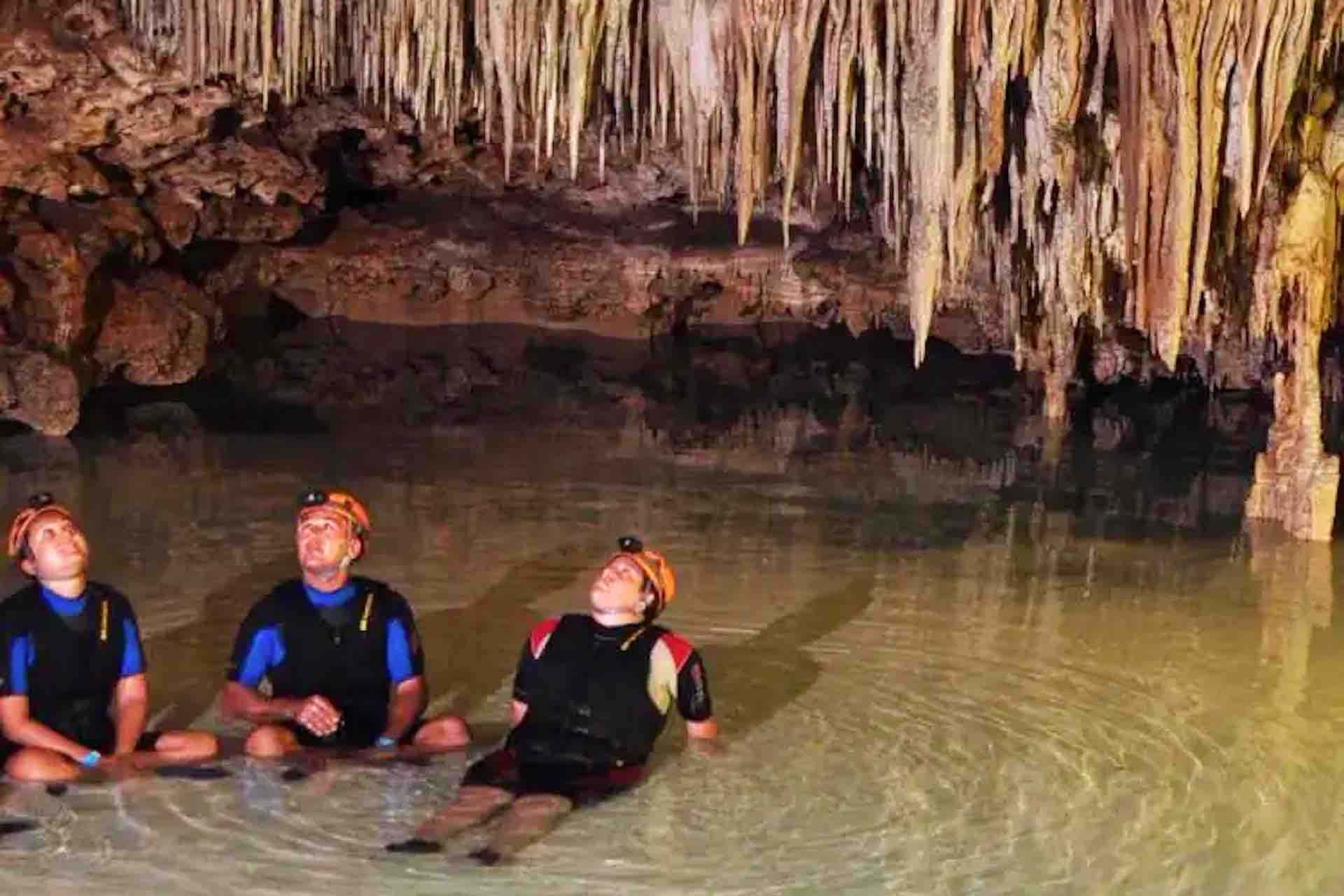 ATV Playa del Carmen Secret Caves tour guests looking up