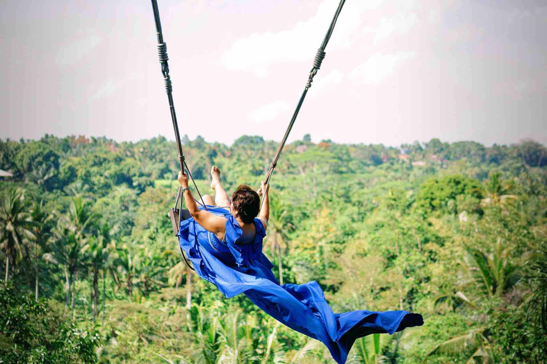 Bali Instagram tour Jungle Swing Bali woman in blue dress