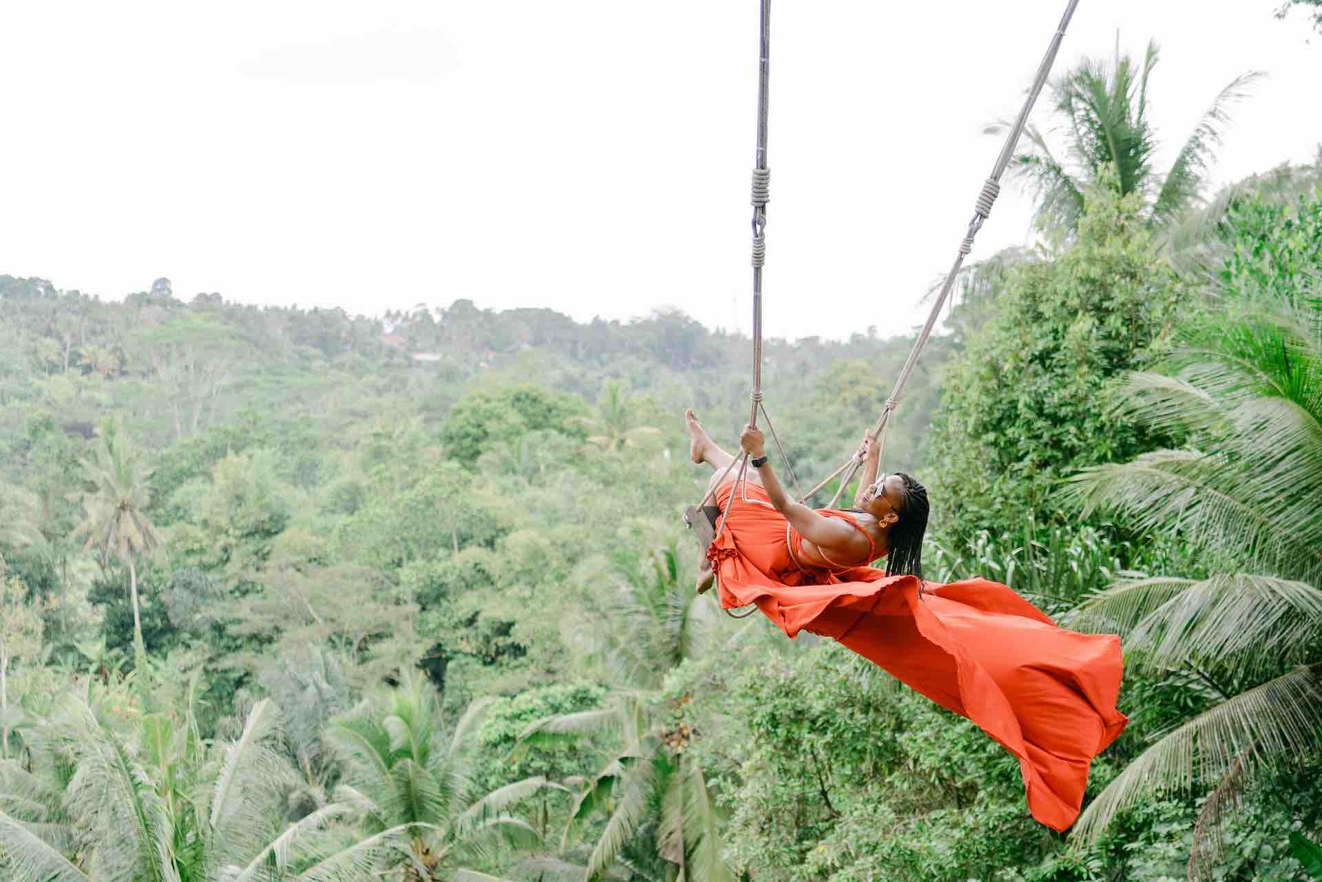 Bali Instagram tour Jungle Swing Bali woman in orange dress