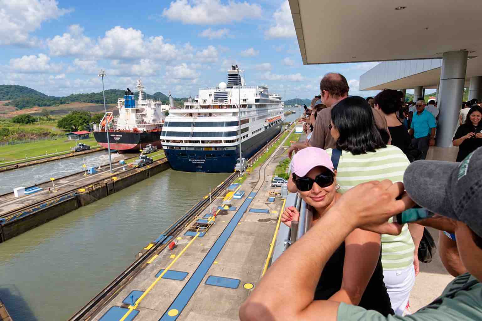 Ships at the Miraflores Locks Visitors watching ships pass through the Miraflores Locks on a Panama Canal tour