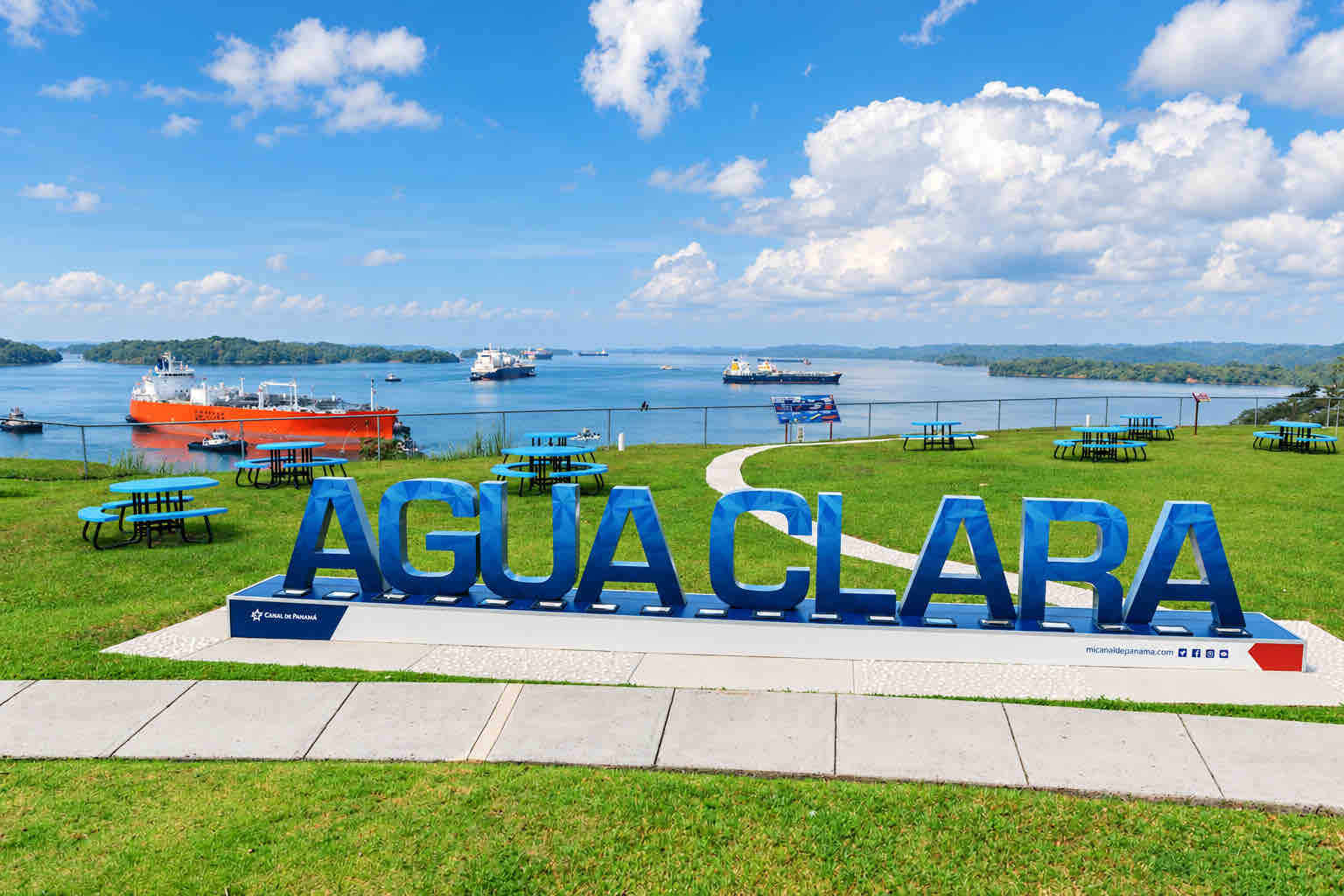 Agua Clara sign overlooking the canal and passing ships.