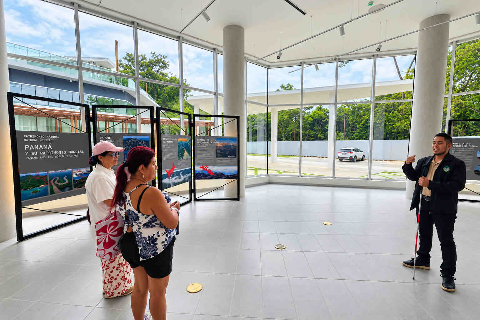 Guide speaking to guests inside a heritage exhibition on a Panama Canal Shore Excursion from Colón