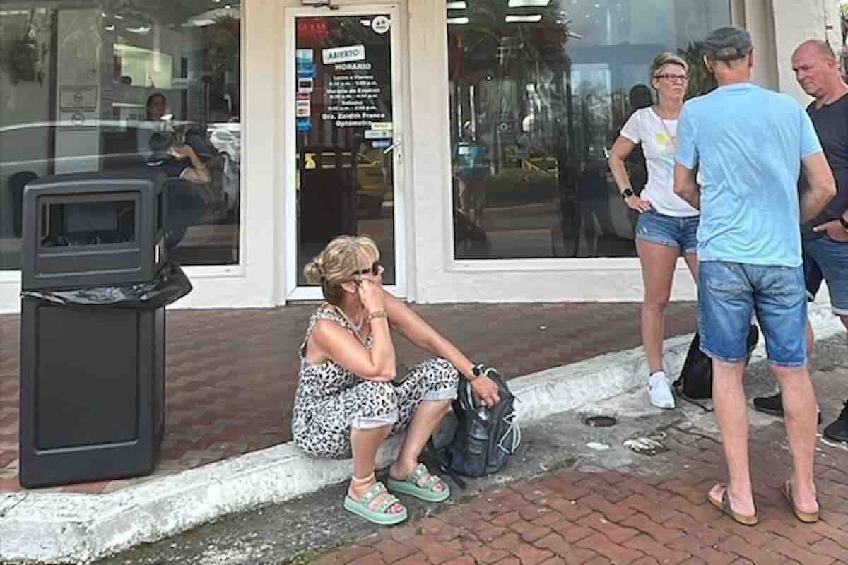 Monkey Island &Amp; Sloth Sanctuary Tour In Panama City – My Complete Experience + Tips 3 Monkey Island & Sloth Sanctuary Tour, Panama wildlife tours, Panama City tours, Panama wildlife day trips people waiting on cobble stone street