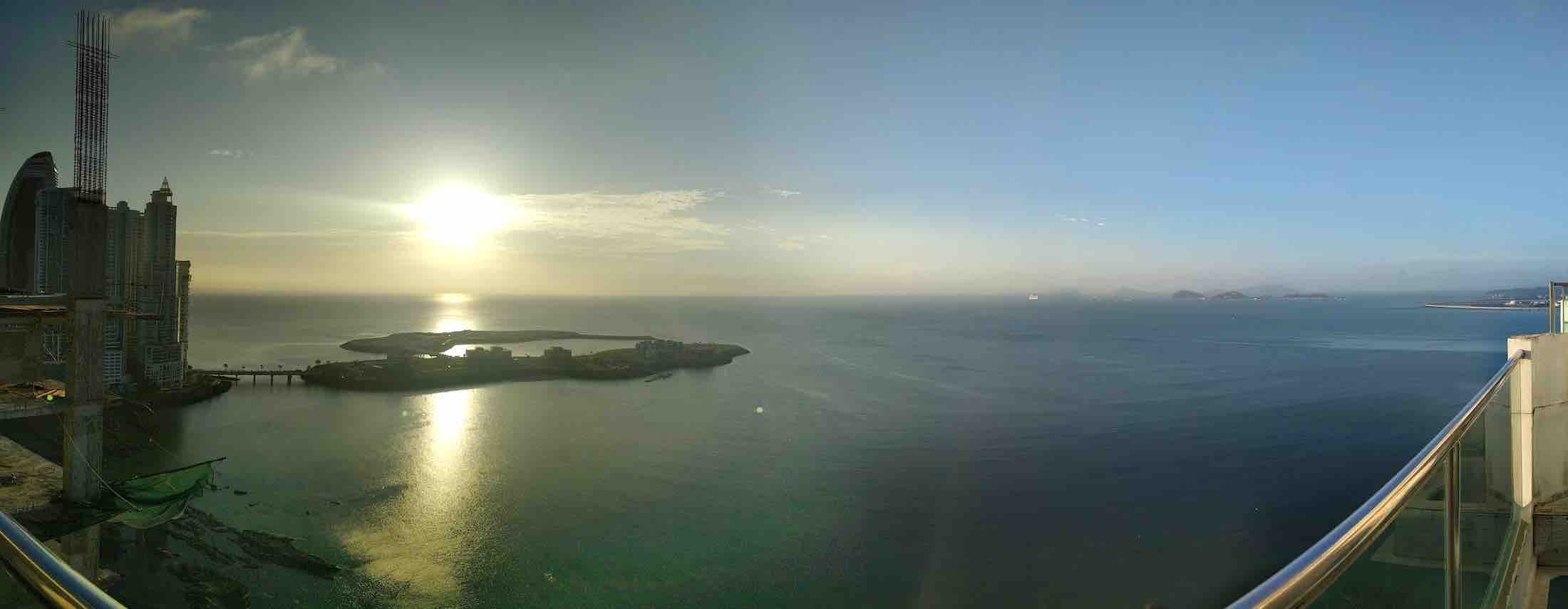 Monkey Island &Amp; Sloth Sanctuary Tour In Panama City – My Complete Experience + Tips 1 Panoramic sunrise view over the Pacific Ocean from my Panama City hotel balcony, overlooking skyscrapers and coastal islands.
